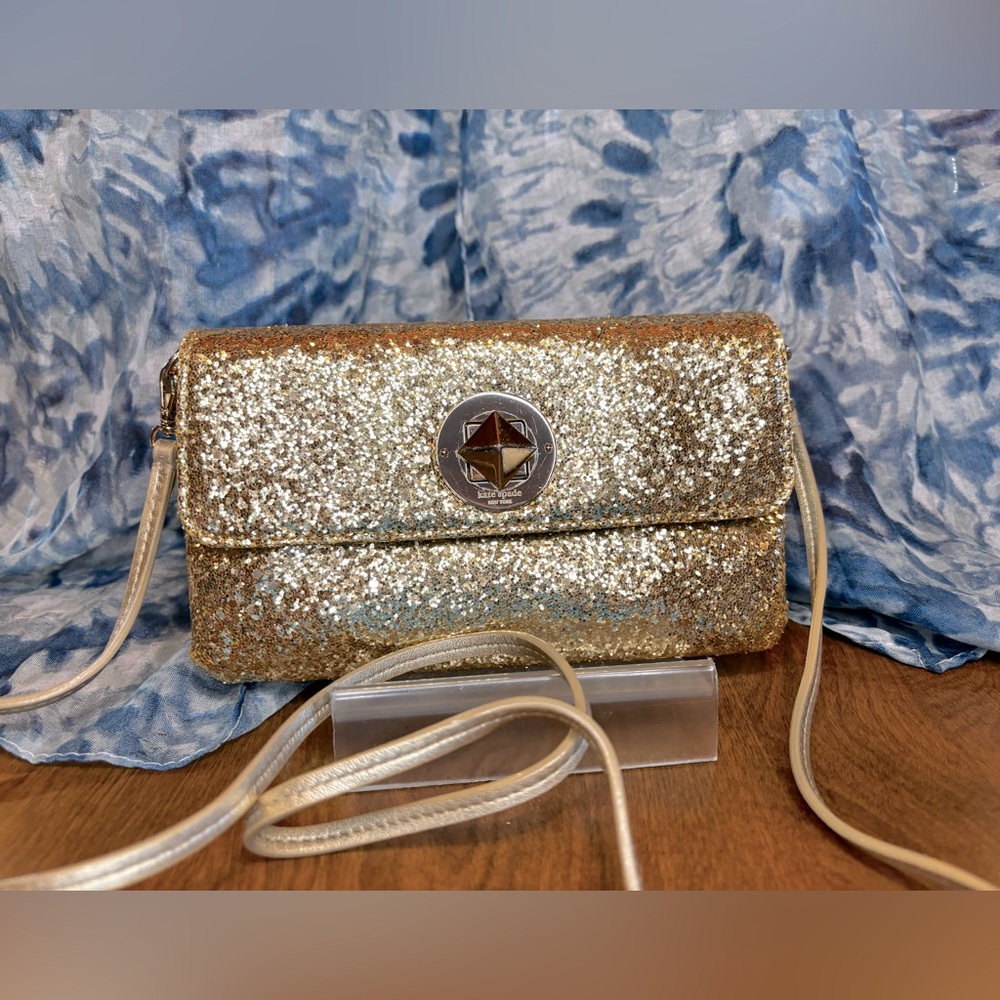 Kate Spade gold glitter crossbody bag. 23” drop on strap. 8”W x 4 1/2 “H  used